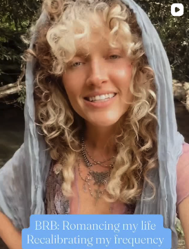 Teddi smiling in a blue veil